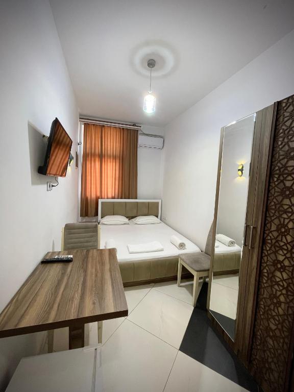 Postel nebo postele na pokoji v ubytování Hotel Heimli