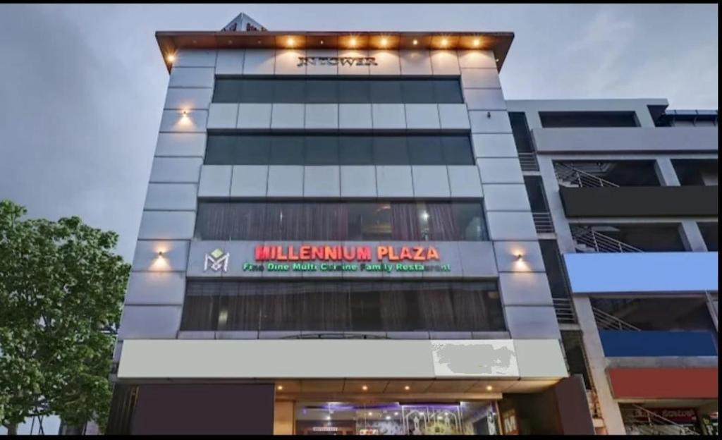 een gebouw met een bord aan de zijkant bij Octave Millenium Suites in Bangalore