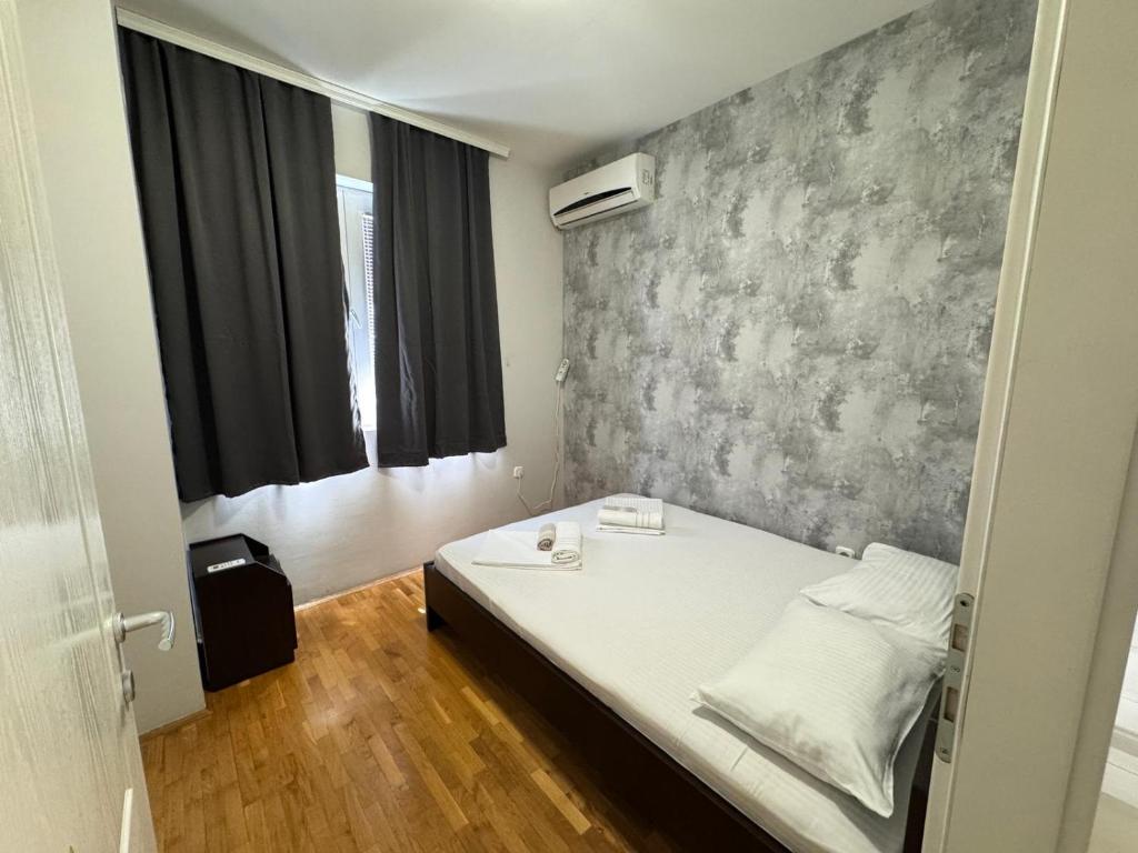 Postel nebo postele na pokoji v ubytování Apartments Philip II