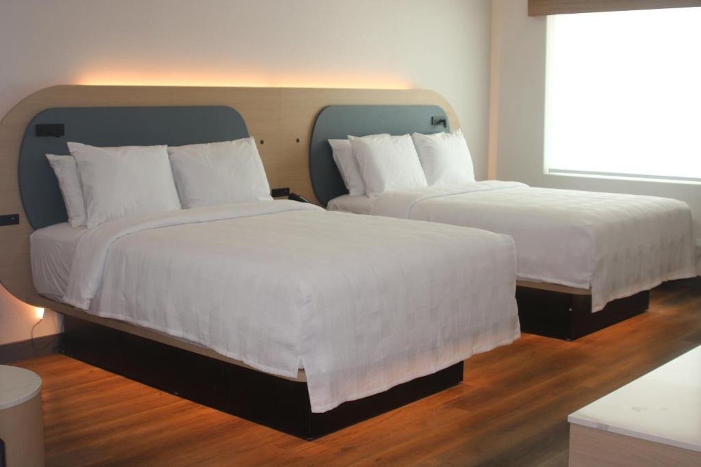 Postel nebo postele na pokoji v ubytování Hotel Lydia