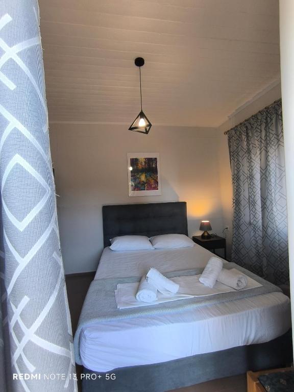 Postel nebo postele na pokoji v ubytování Poseidon Apartments