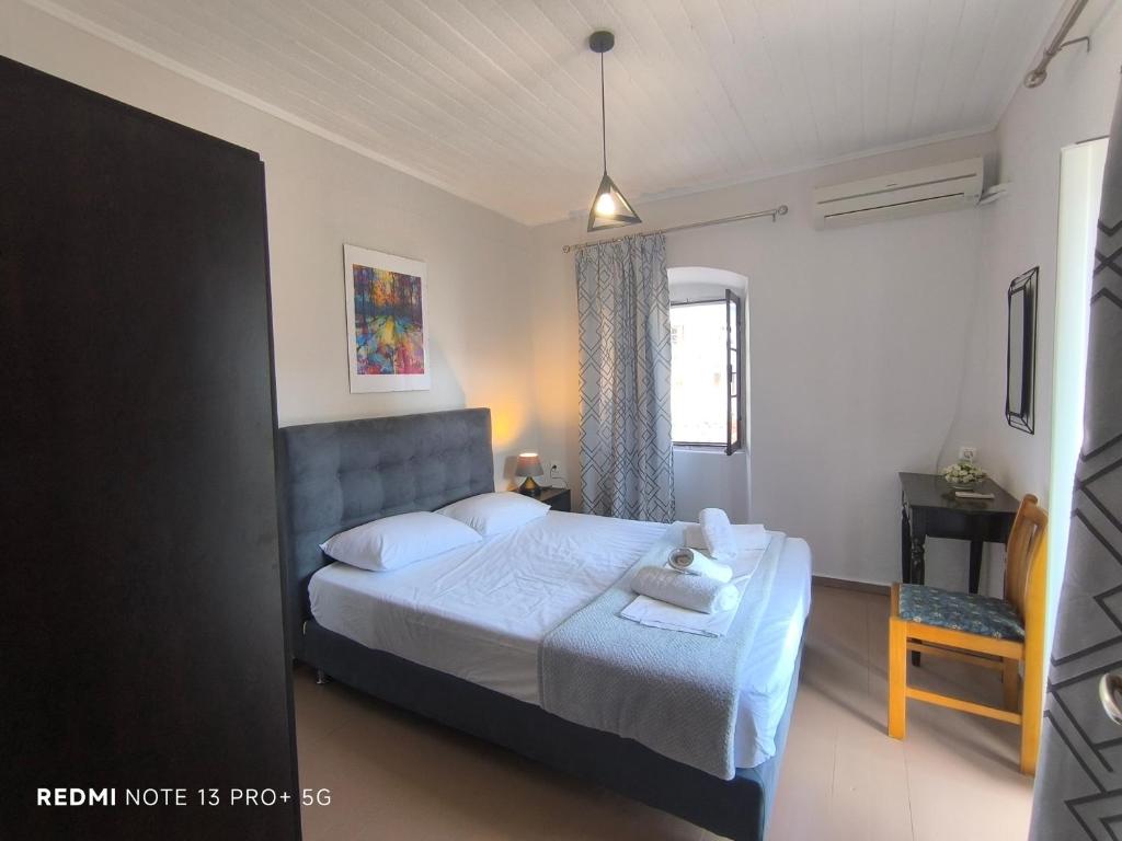 Postel nebo postele na pokoji v ubytování Poseidon Apartments