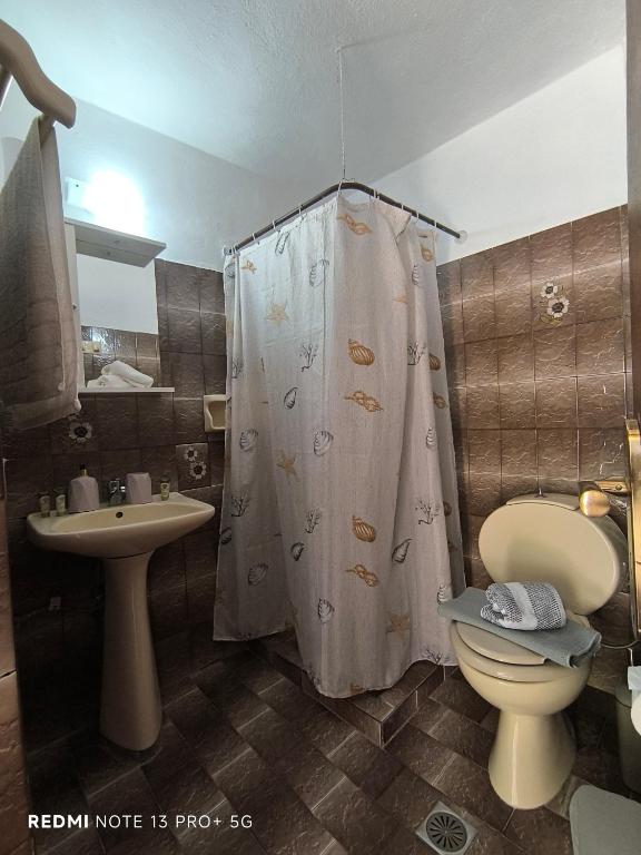 Koupelna v ubytování Poseidon Apartments