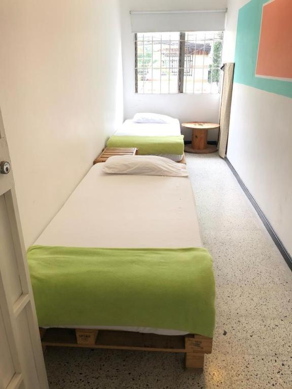 Postel nebo postele na pokoji v ubytování Hostal paz y vida