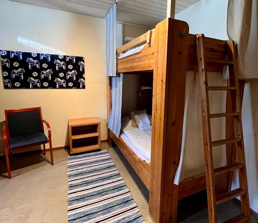 Postel nebo postele na pokoji v ubytování Målkullorna Hostel