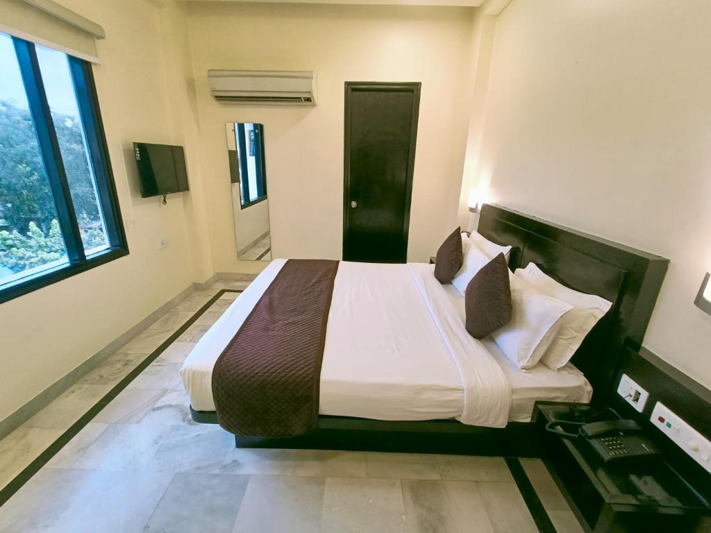 Postel nebo postele na pokoji v ubytování Hotel Sun Grand