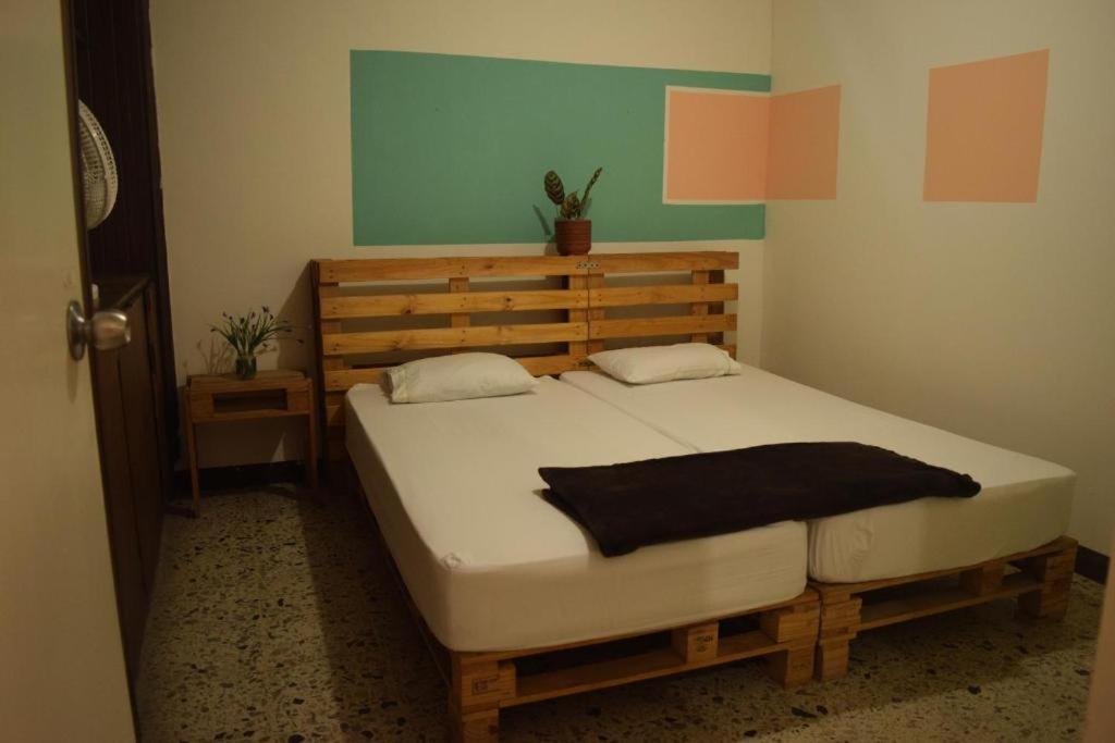 Postel nebo postele na pokoji v ubytování Hostal paz y vida