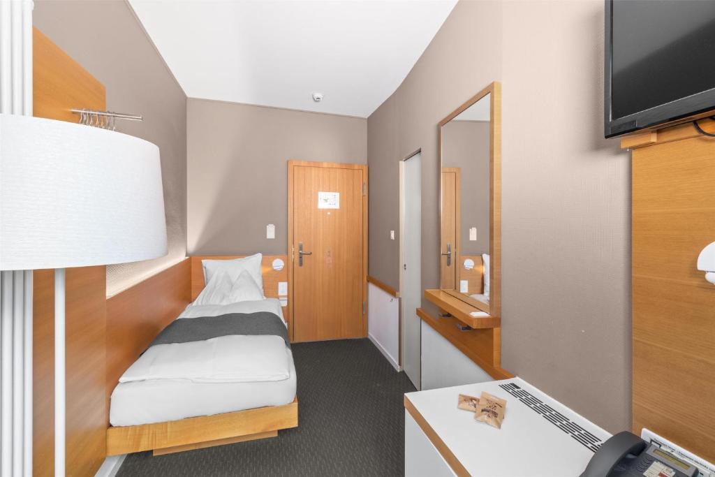 Televisyen dan/atau pusat hiburan di Best Western Plus Hotel Zürcherhof