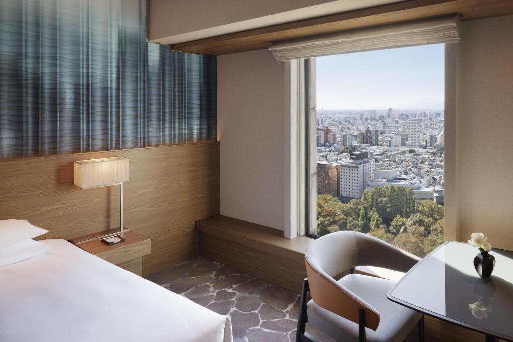 Postel nebo postele na pokoji v ubytování Hyatt Regency Tokyo