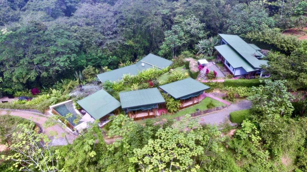 an overhead view of a group of houses with trees at Eden Tica Lodge in Uvita
