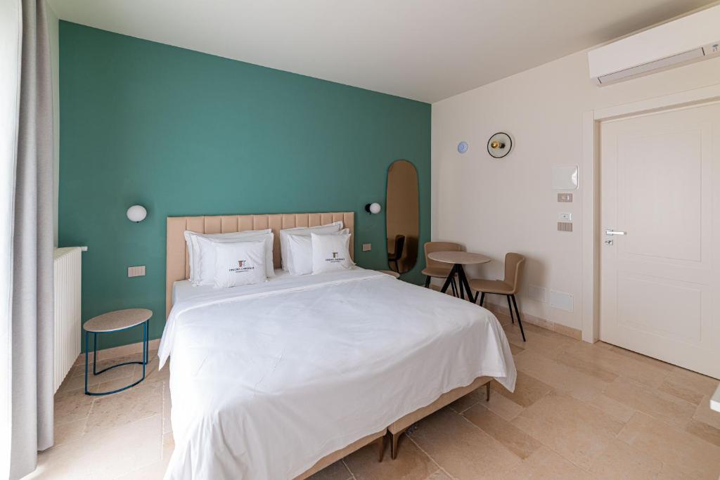 Postel nebo postele na pokoji v ubytování Suites Dimora Garibaldi