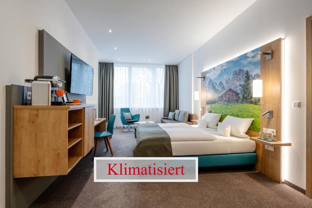 Postel nebo postele na pokoji v ubytování AVALON Hotel Bad Reichenhall