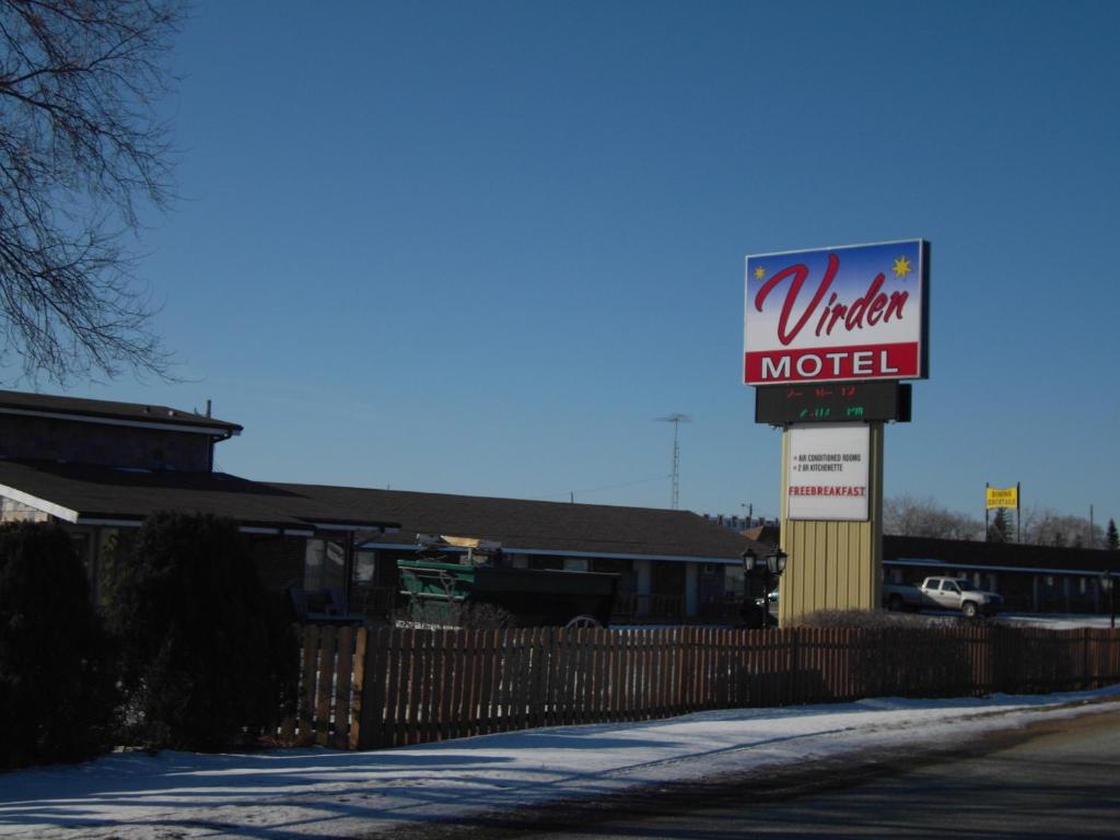 a united motel sign in front of a building at Virden Motel in Virden
