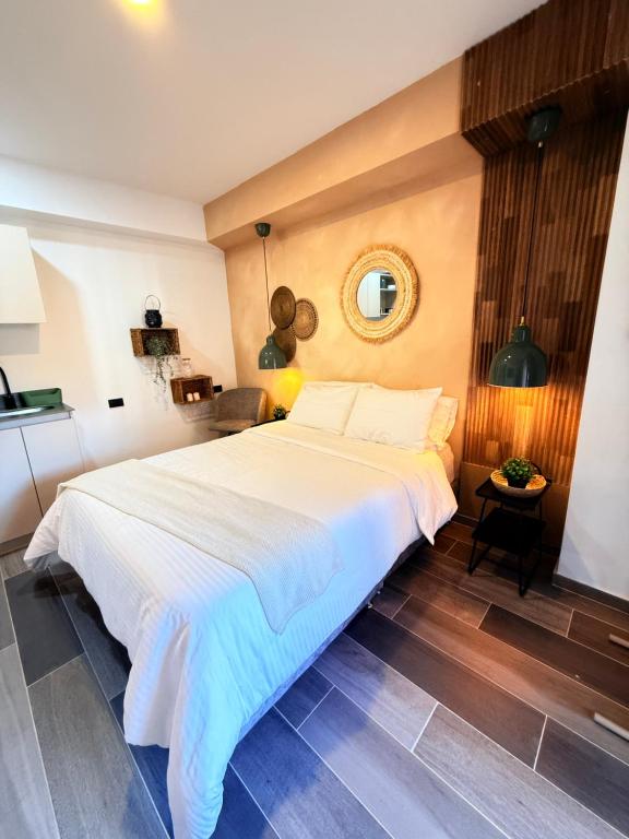 Ένα ή περισσότερα κρεβάτια σε δωμάτιο στο Apto boho Design edificio bit
