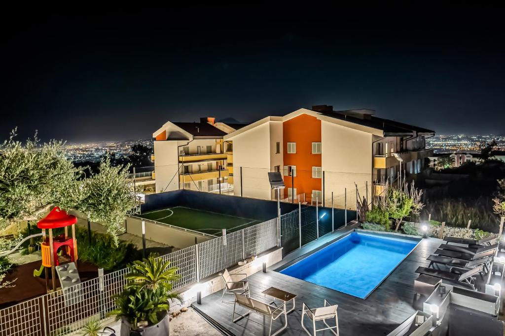 a house with a swimming pool at night at Casa Consiglia in Corbara