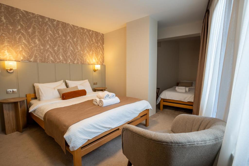 Postel nebo postele na pokoji v ubytování Saffron Boutique Hotel