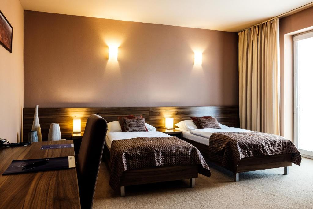 Postel nebo postele na pokoji v ubytování Hotel Comfort with free Wellness and Fitness Centrum