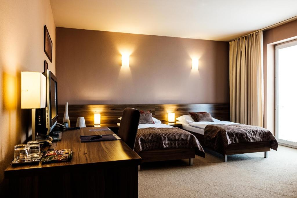 Postel nebo postele na pokoji v ubytování Hotel Comfort with free Wellness and Fitness Centrum