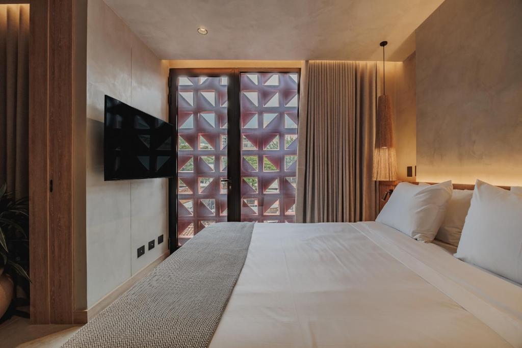 Postel nebo postele na pokoji v ubytování Kuuna Luxury Stays by Wynwood House