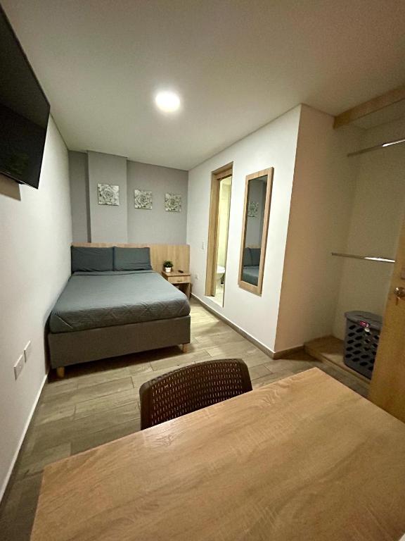 Postel nebo postele na pokoji v ubytování Hostelfc Teusaquillo