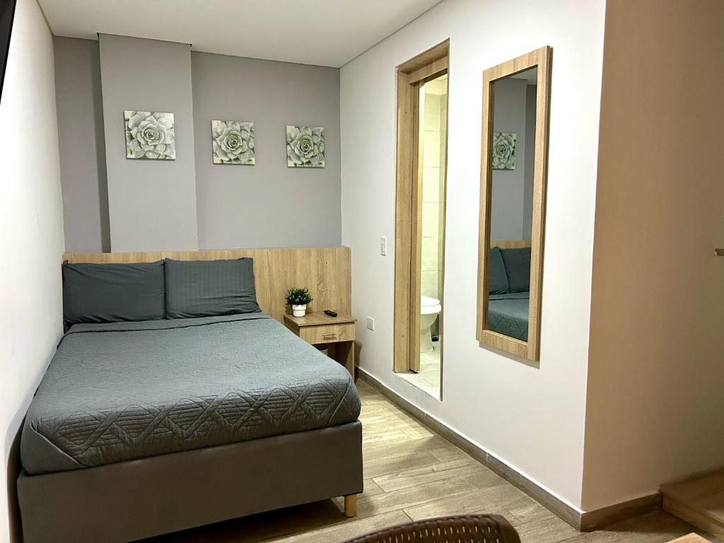 Postel nebo postele na pokoji v ubytování Hostelfc Teusaquillo
