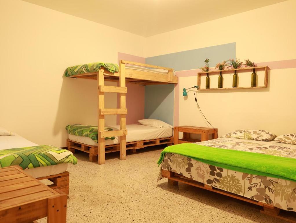 Postel nebo postele na pokoji v ubytování Hostal paz y vida