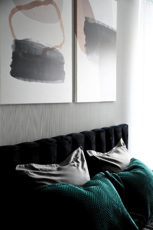 Posteľ alebo postele v izbe v ubytovaní Apartamenty STUDIO