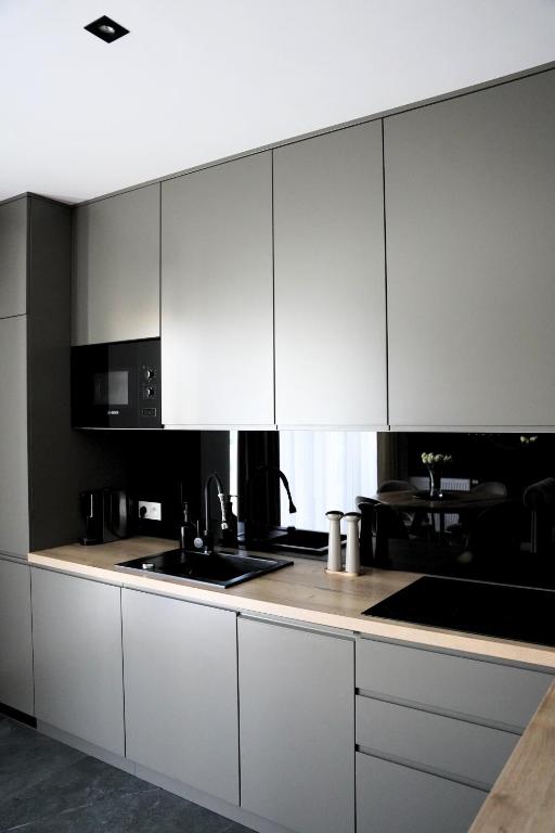 Kuchyňa alebo kuchynka v ubytovaní Apartamenty STUDIO