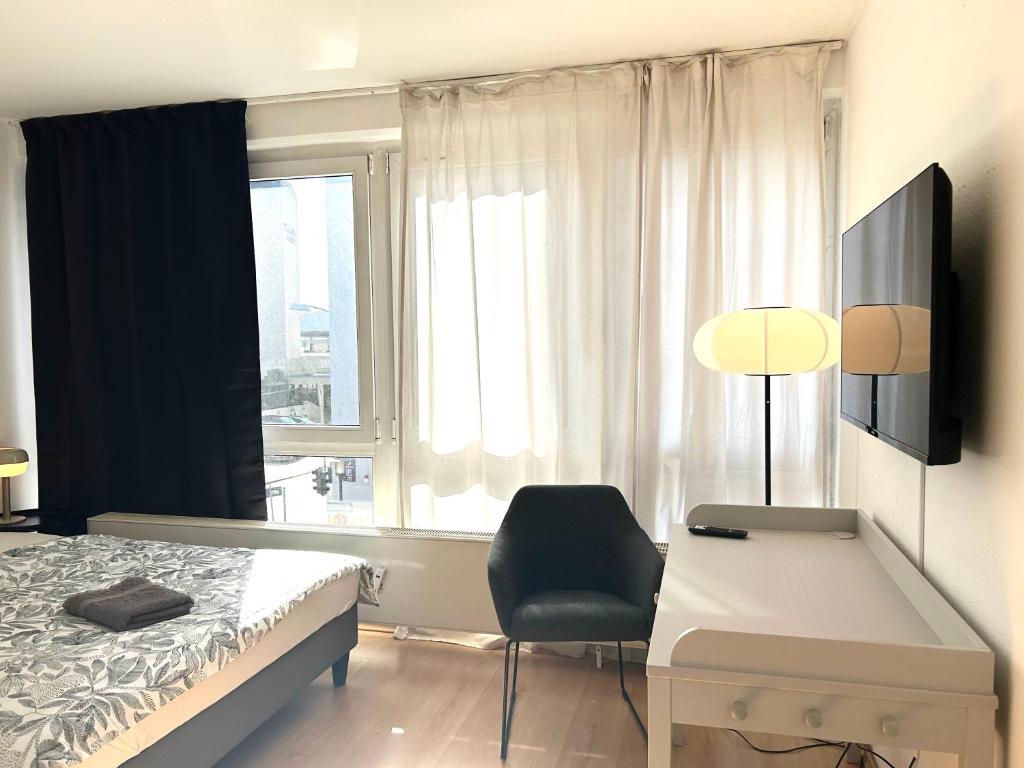 TV a/nebo společenská místnost v ubytování VIKTORIA RESIDENCE