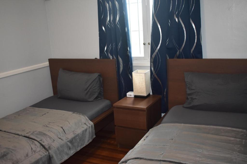 Postel nebo postele na pokoji v ubytování Villa Blue Vue