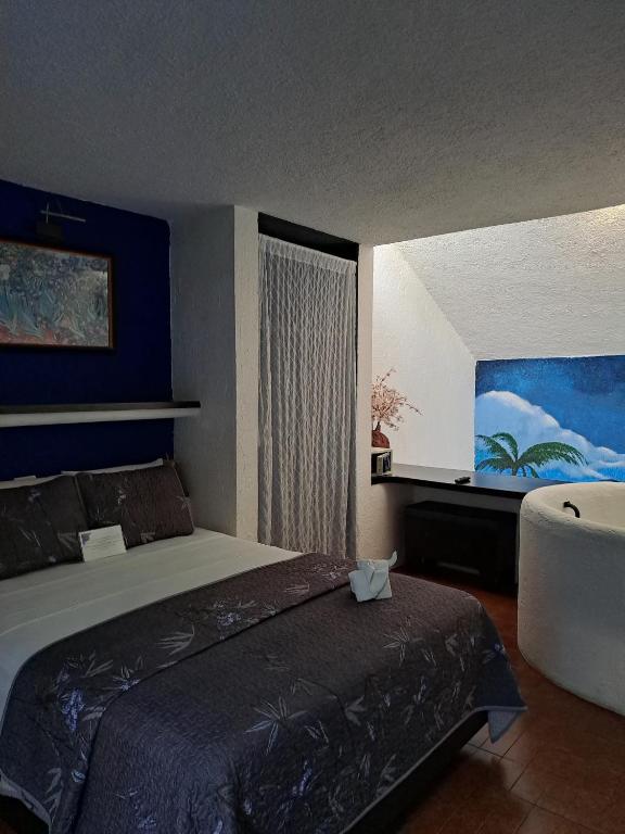 Postel nebo postele na pokoji v ubytování Hotel Villas Las Anclas