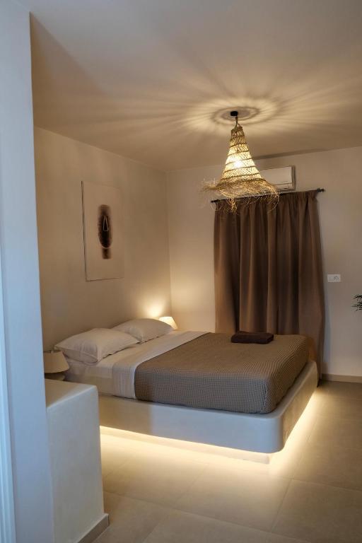 Postel nebo postele na pokoji v ubytování Cycladic Charm