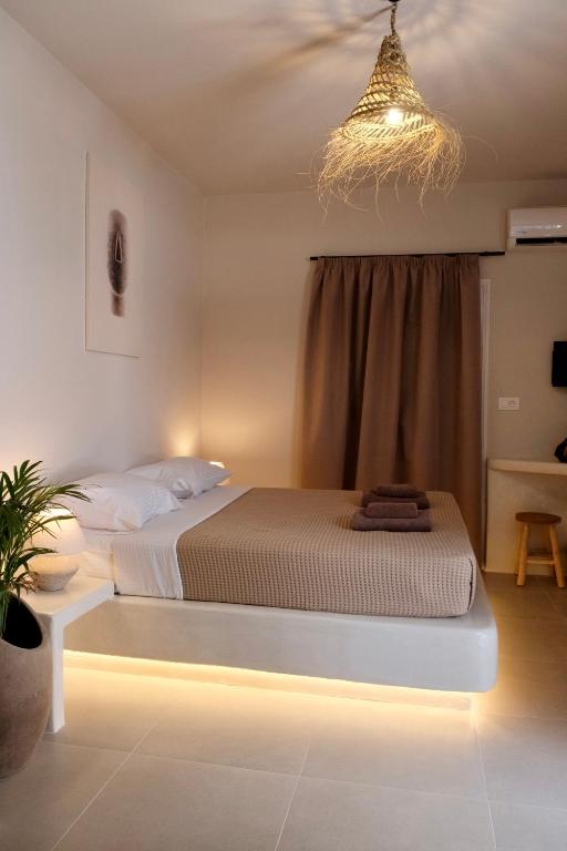 Postel nebo postele na pokoji v ubytování Cycladic Charm