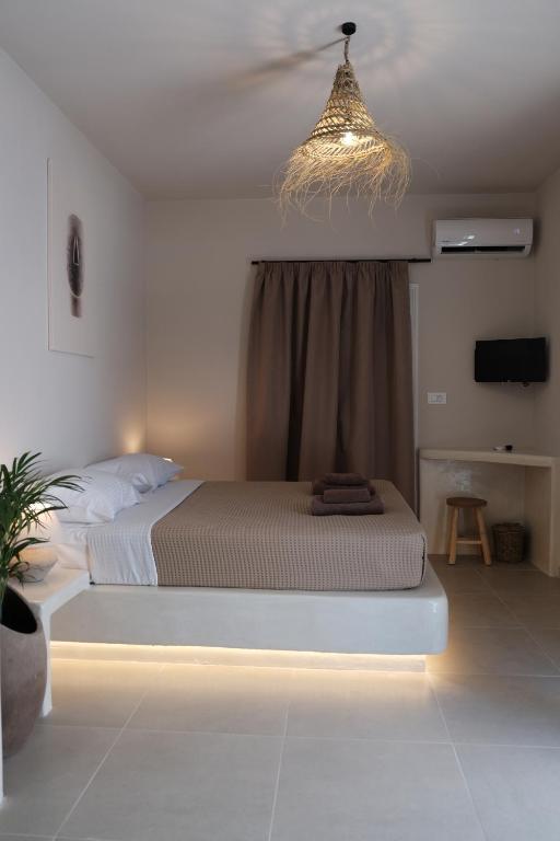 Postel nebo postele na pokoji v ubytování Cycladic Charm