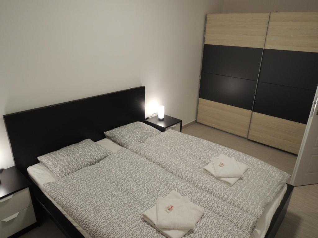 Postel nebo postele na pokoji v ubytování Apartmány Hlohovec