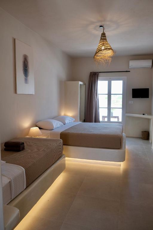 Postel nebo postele na pokoji v ubytování Cycladic Charm