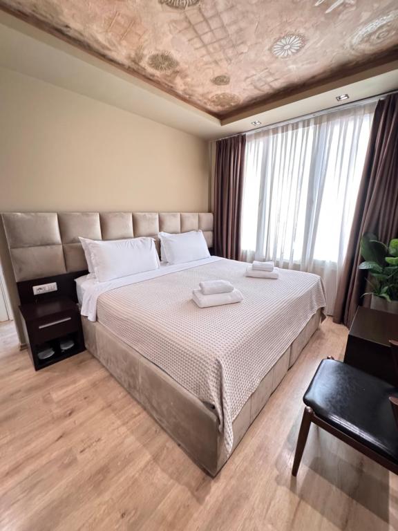 Postel nebo postele na pokoji v ubytování 4R Colombo Hotel