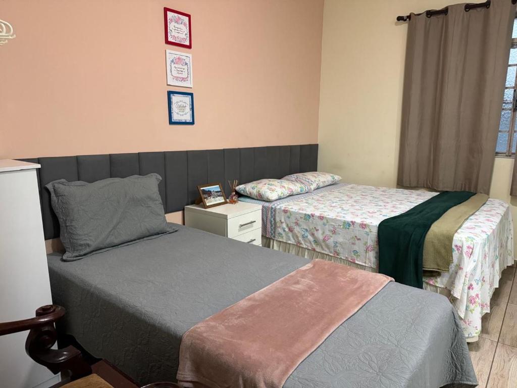 Ένα ή περισσότερα κρεβάτια σε δωμάτιο στο Estilo Residence