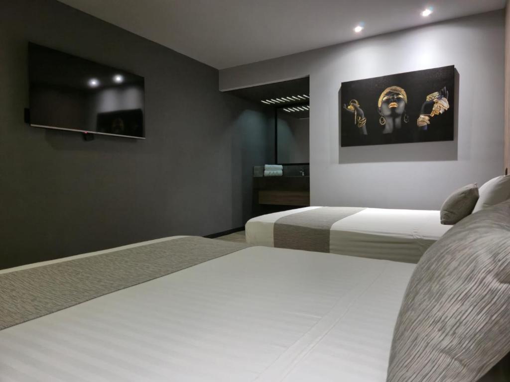 Postel nebo postele na pokoji v ubytování Avanta Hotel & Villas Querétaro