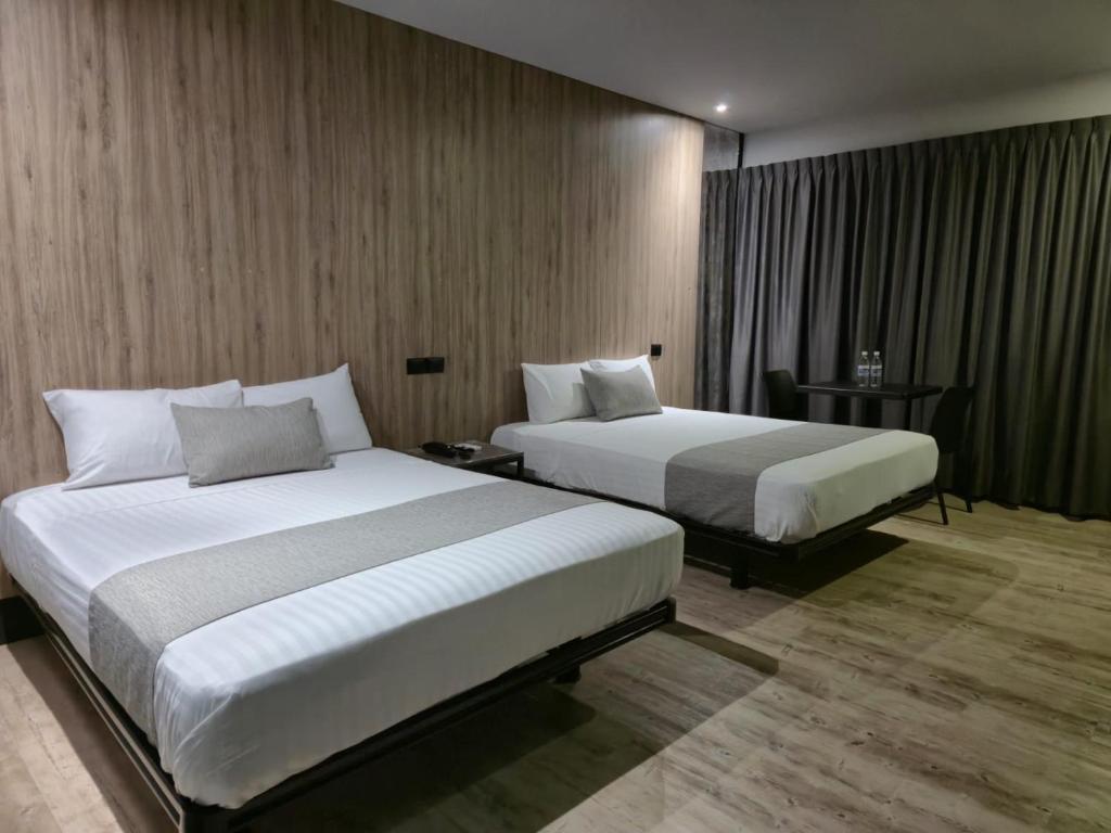 Postel nebo postele na pokoji v ubytování Avanta Hotel & Villas Querétaro