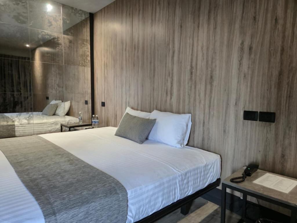 Postel nebo postele na pokoji v ubytování Avanta Hotel & Villas Querétaro