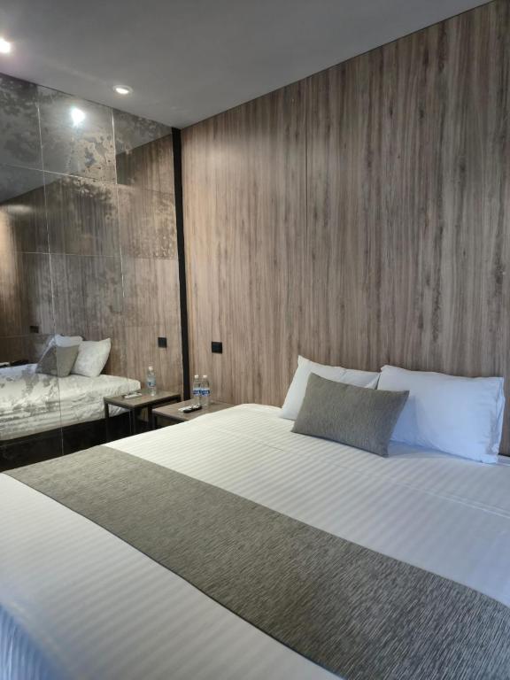 Postel nebo postele na pokoji v ubytování Avanta Hotel & Villas Querétaro