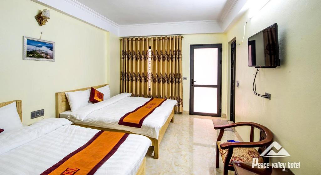 Ένα ή περισσότερα κρεβάτια σε δωμάτιο στο SaPa Peace Valley hotel