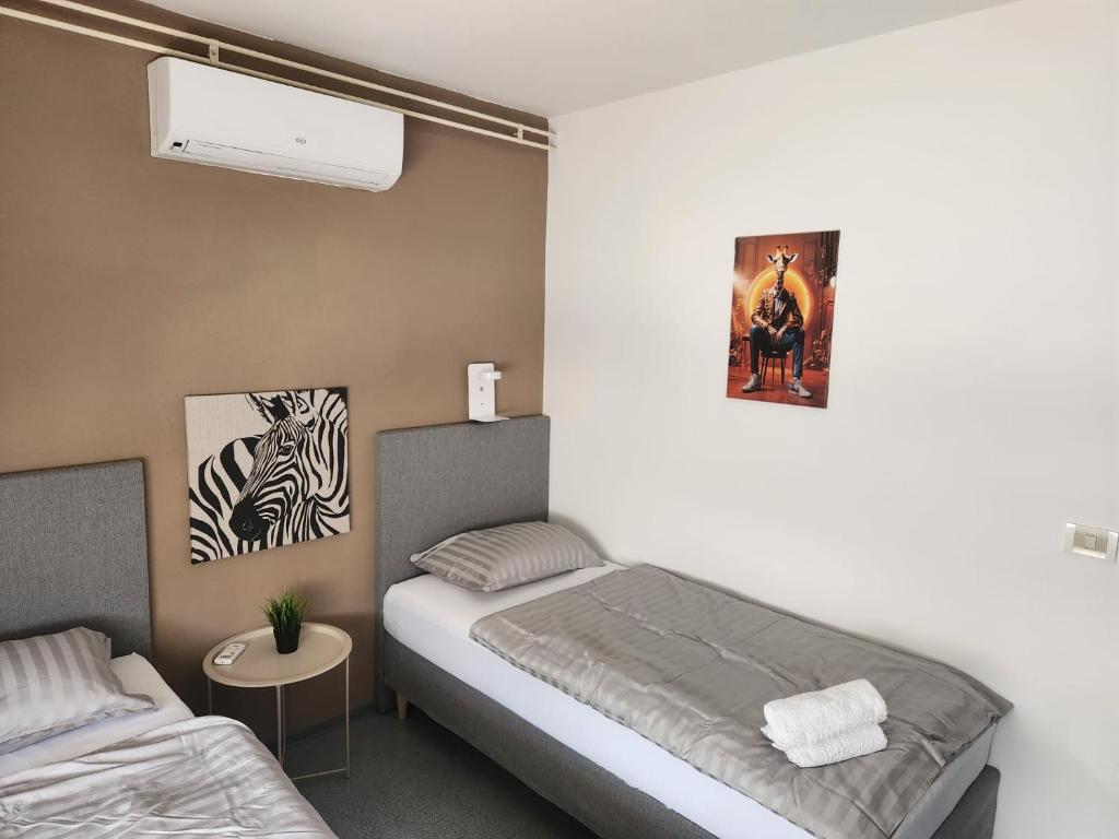 Postel nebo postele na pokoji v ubytování Hostel POINT