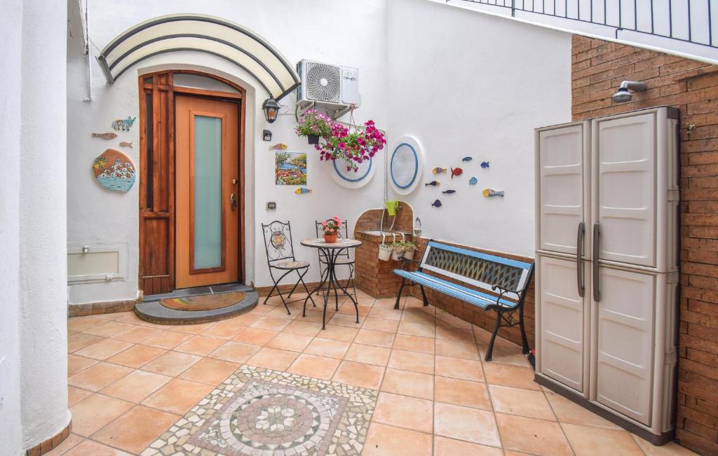 a room with a bench and a door and a table at 1 Bedroom Nice Apartment In Molina in Marina