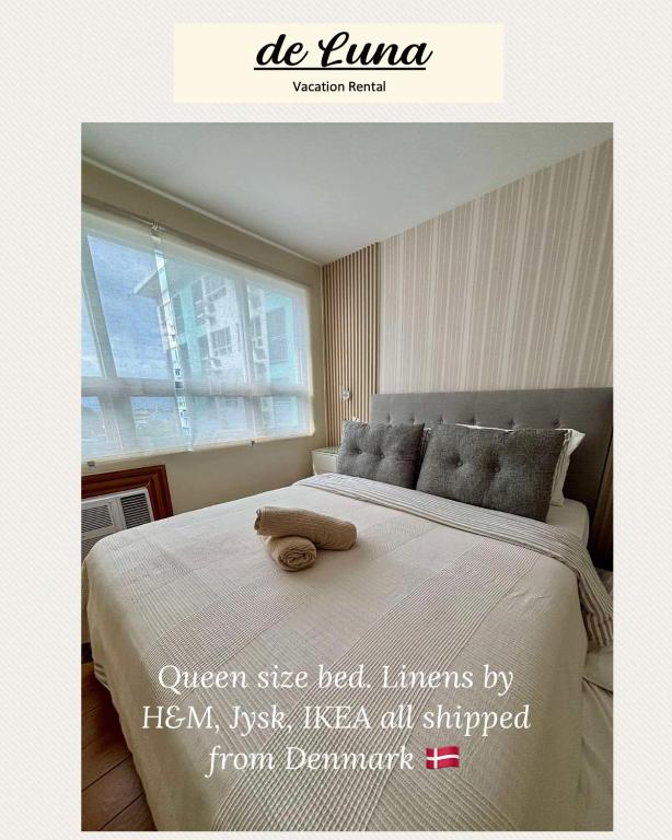a poster of a bed with a stuffed animal on it at de Luna Vacation Rental in Davao City