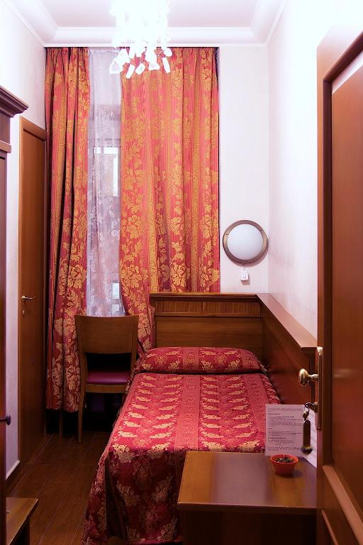 Postel nebo postele na pokoji v ubytování Hotel Caravaggio