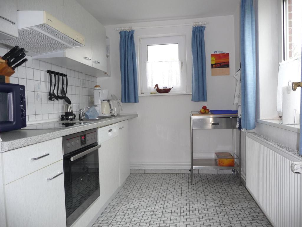 Kuchyň nebo kuchyňský kout v ubytování Haus Heverstrom