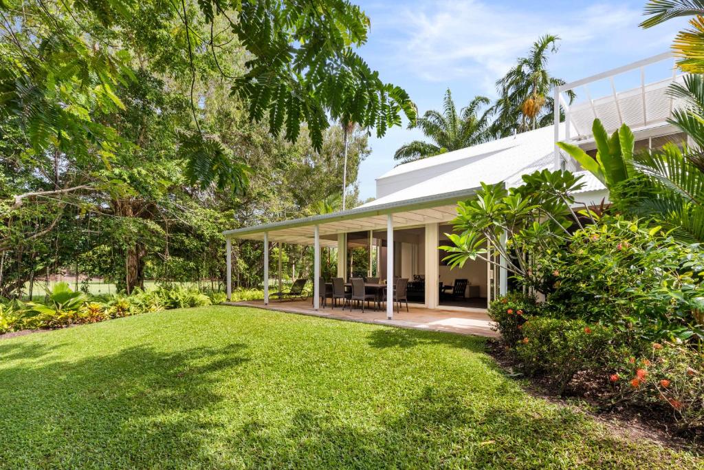 an exterior view of a house with a yard at Mirage Resort Villa 112 with access to Sheraton Facilities in Port Douglas