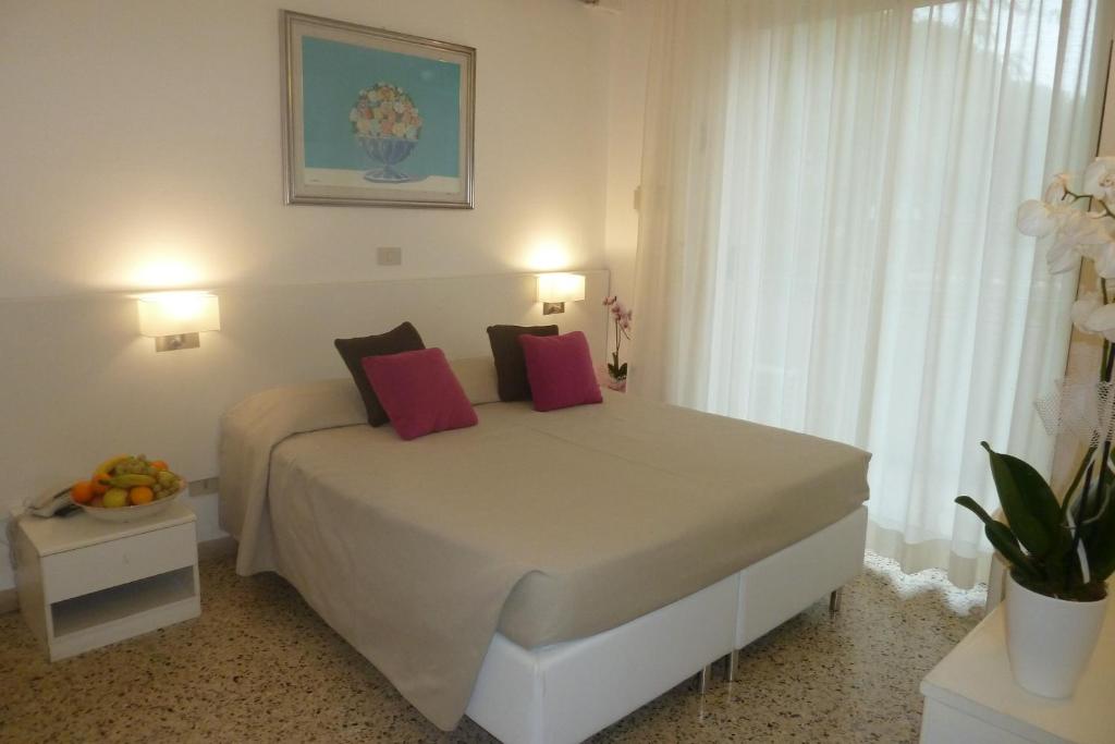 Postel nebo postele na pokoji v ubytování Hotel Astra